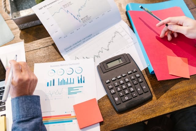 Calculator, tax, budget plan on a desk