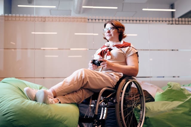 Lady in a wheelchair relaxing in a room