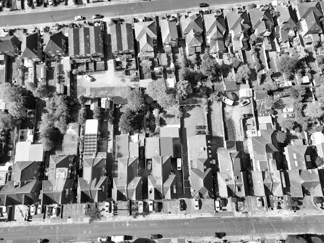 aerial-view-of-residential-neighborhood-with-uniform-roof-patterns