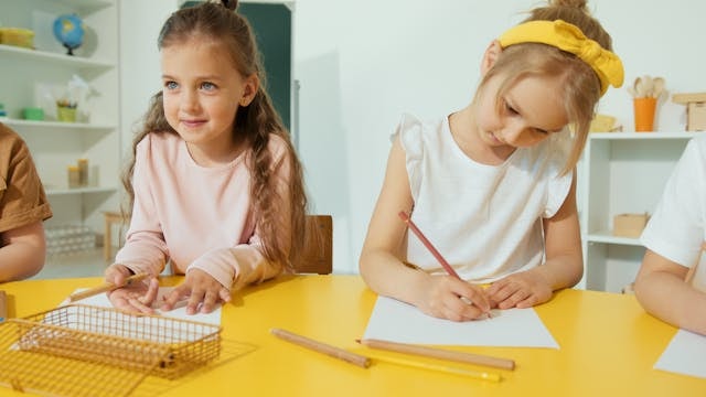 young-girls-writing-on-the-paper