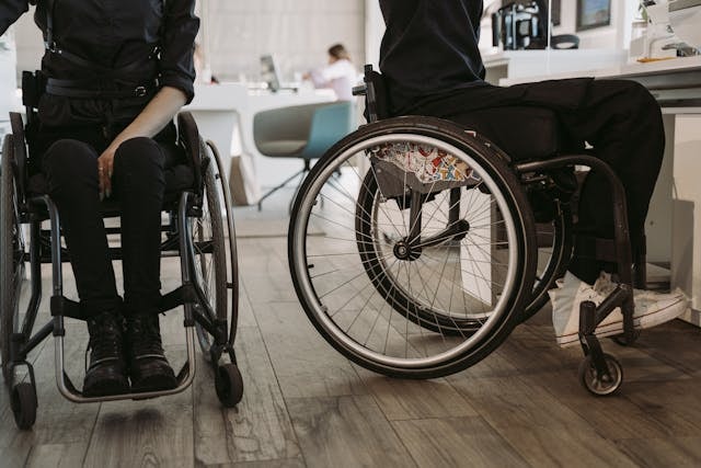 person-in-black-pants-and-black-shirt-sitting-on-wheelchair