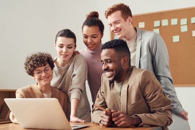 photo-of-people-looking-on-laptop