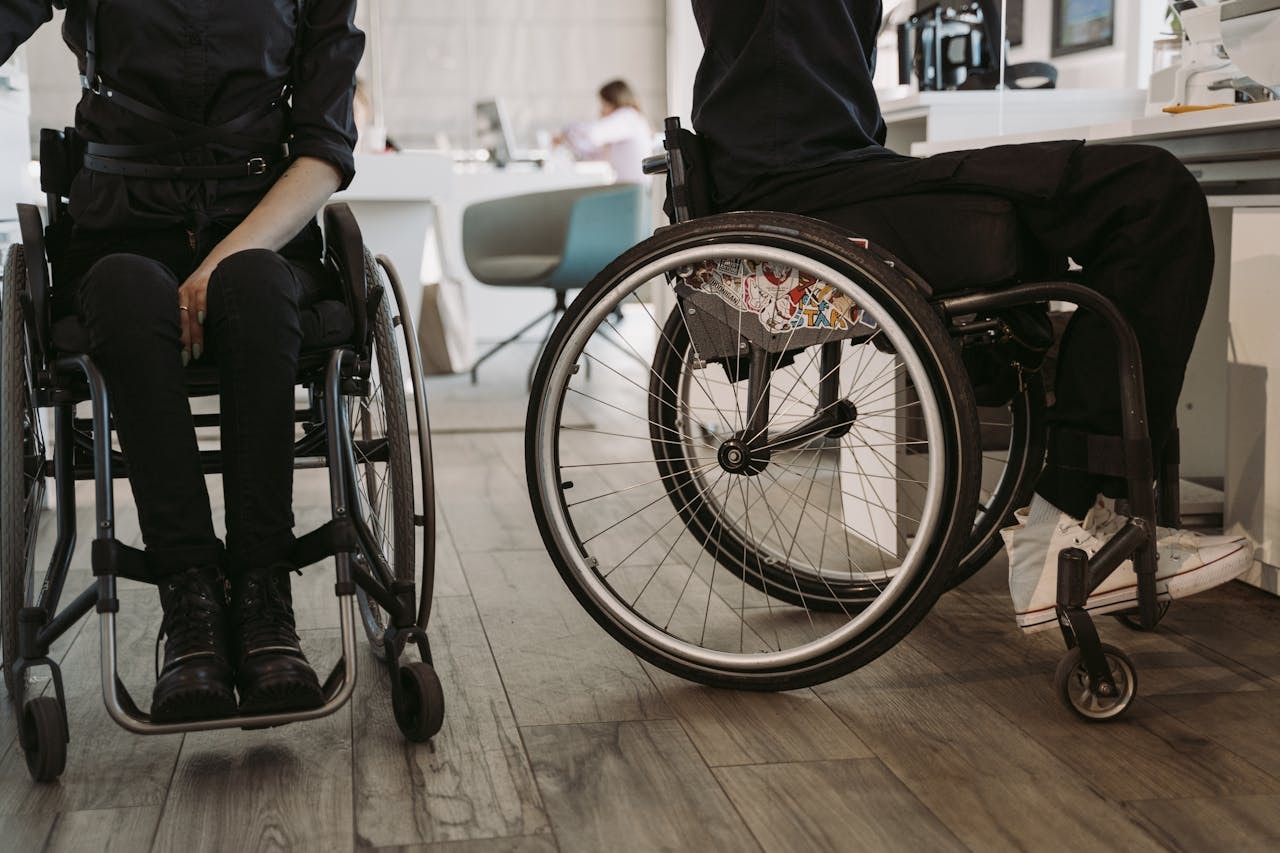 2 person in wheelchairs