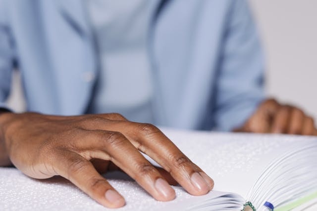 Man-reading-a-braille