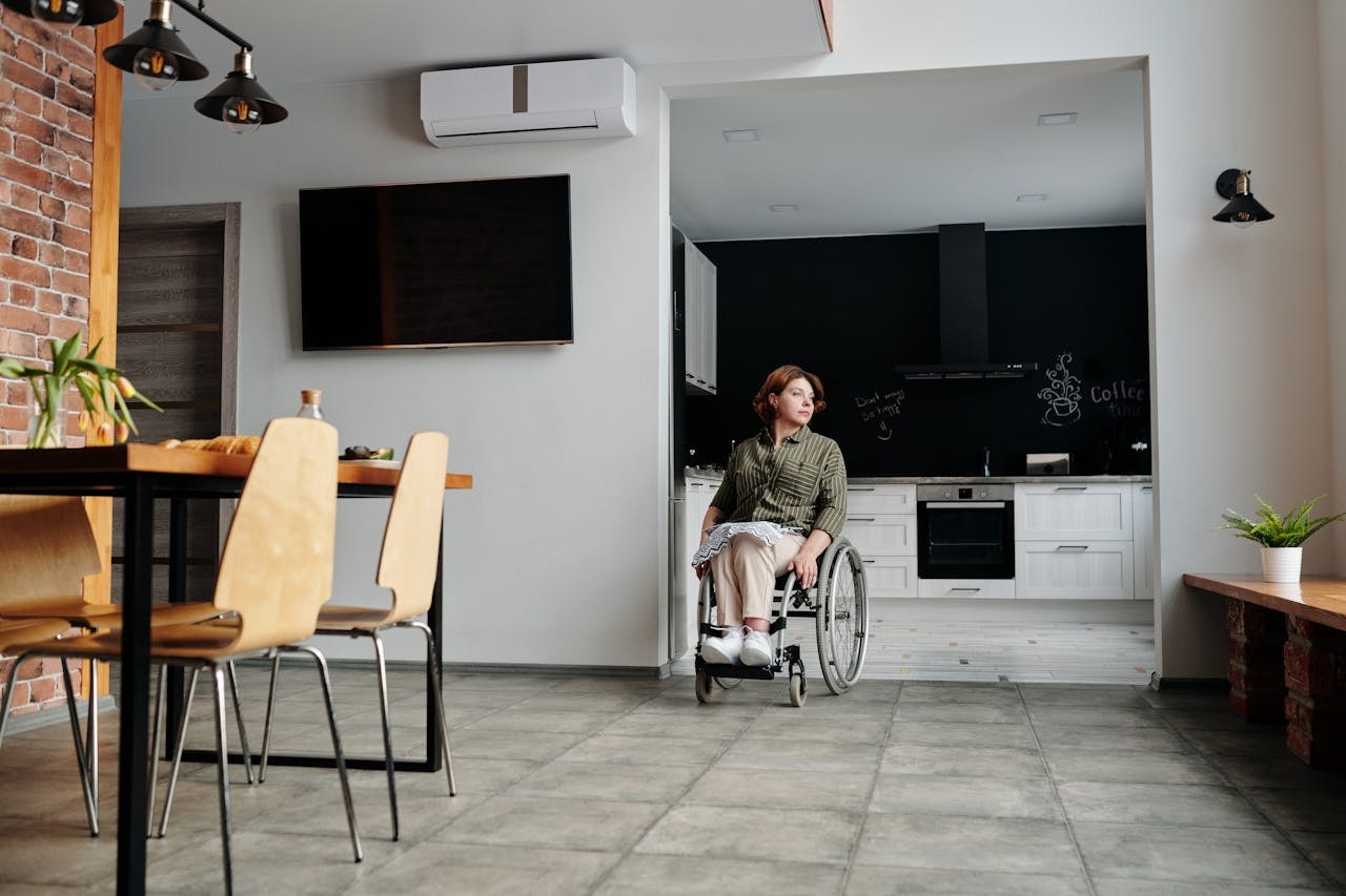 woman-sitting-on-wheelchair-while-looking-away