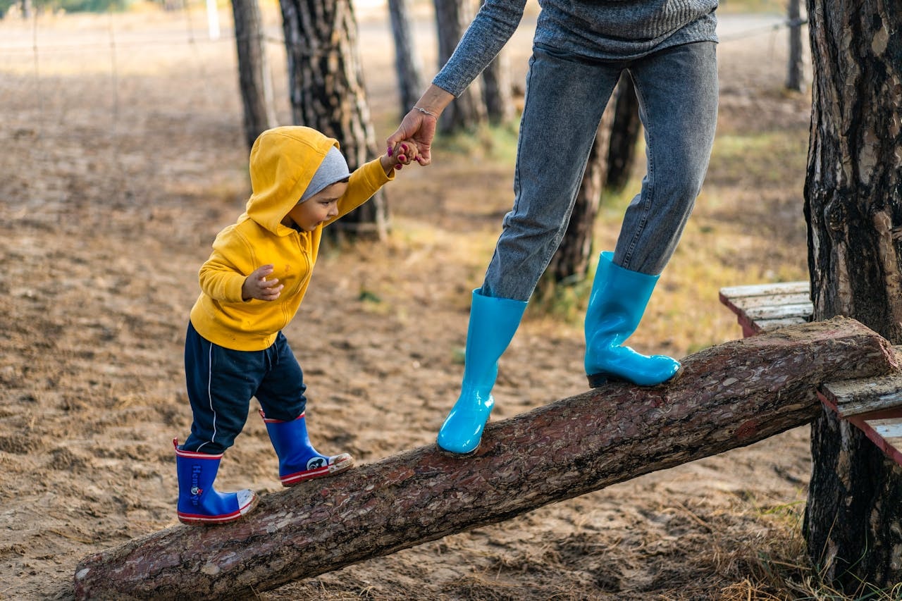 kid walking on a log