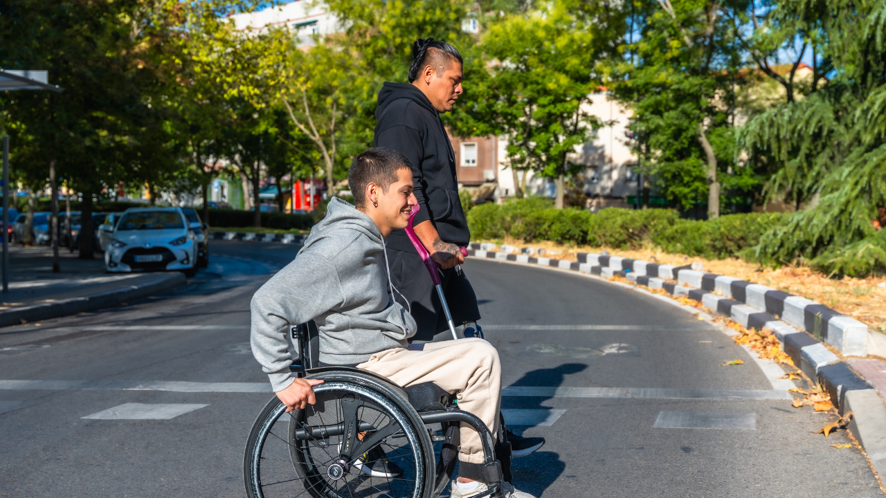 Person on wheelchair crossing the street
