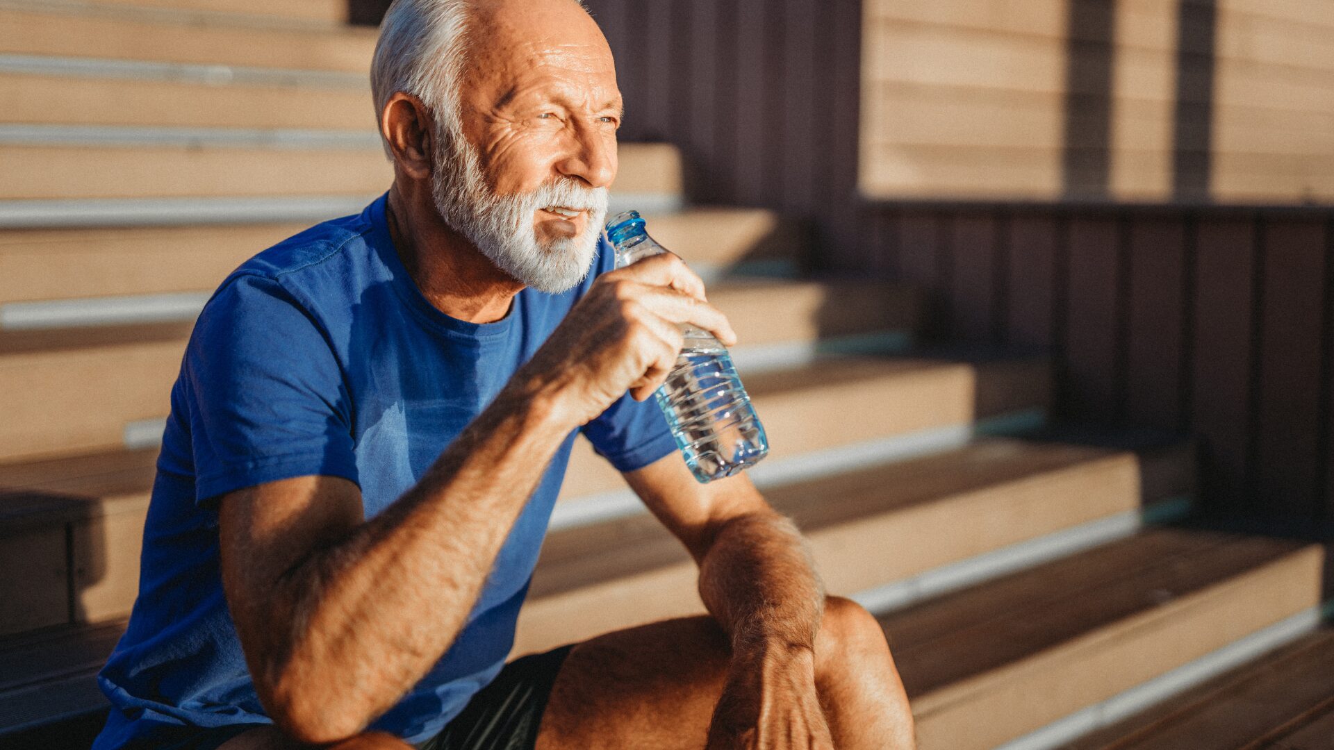 old man drinking water